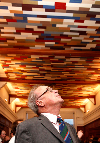 Aidan Powell who graduated from UCD School of Architecture in 1964 finds his name on the ceiling installation during the opening event