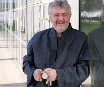 Bill Whelan pictured with the UCD Foundation Day Medal 