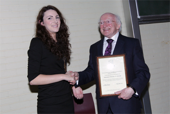 Sinead Rooney, Auditor of the UCD Law Society presents President of Ireland, Michael D Higgins with the Presidency of the UCD Law Society
