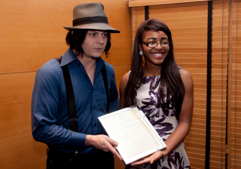 Daisy Onubogu, Auditor of the UCD Literary & Historical Society presents Jack White with the James Joyce Award