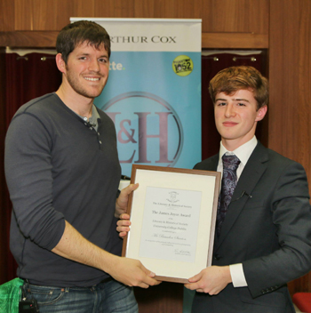 Caption: Brandon Stanton, the creator of Humans of New York is presented with the James Joyce Award by Eoin MacLachlan, Auditor of the UCD Literary & Historical Society, University College Dublin