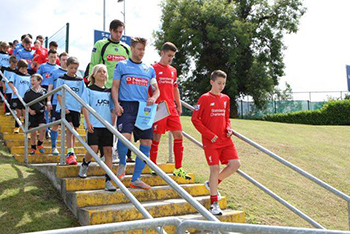 UCD and Liverpool take to the pitch before their friendly in the UCD Bowl 