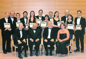 Recipients pictured holding awards.