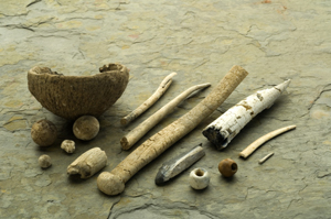 Neolithinc vessel (c.3300 BC), known as Carrowkeel Pot, from the Mound of the Hostages, Hill of Tara. Also seen in photograph beads, balls and fragments of bone and antler pin. 