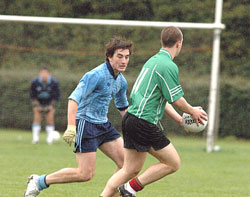 PSNI's Paddy Linnig tests the UCD defence.