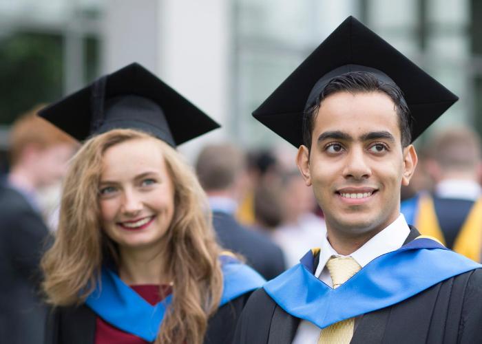 Two students graduating