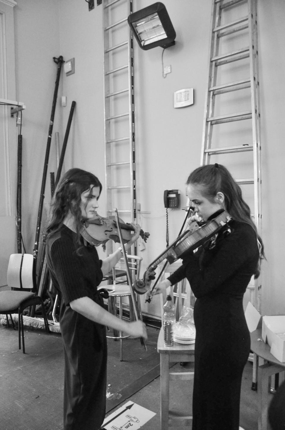 Two students backstage NCH tuning