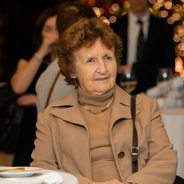 Woman in a brown outfit at the UCD Physiotherapy 70th anniversary celebration