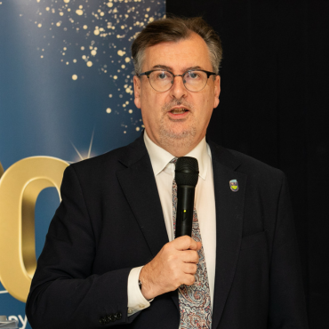Man wearing a suit speaking at the UCD Physiotherapy 70th anniversary celebration