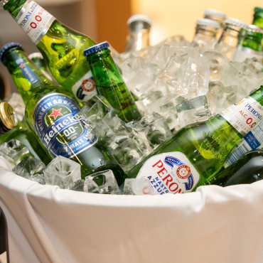 Close up of bottles of beer in an ice bucket