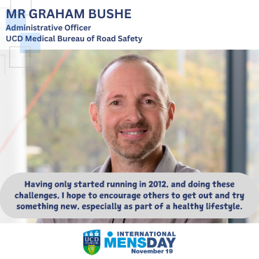 Man in grey shirt smiling to camera for International Men's Day