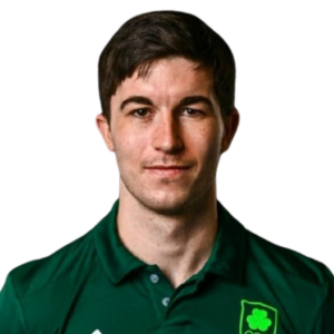 Man with dark hair wearing a green shirt