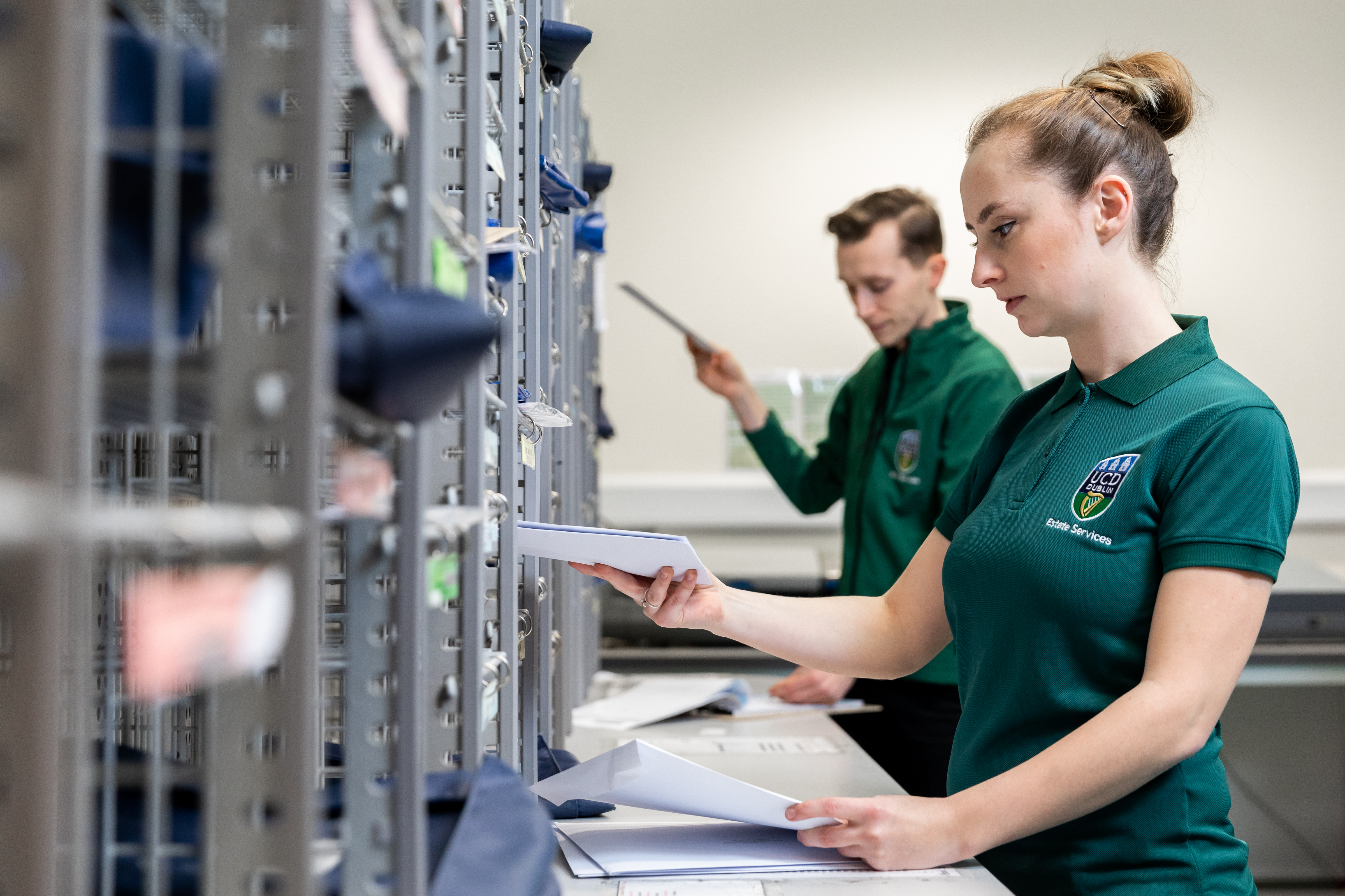 Staff organising mail pigeon holes