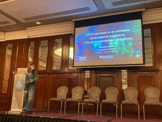 female student giving presentation at conference
