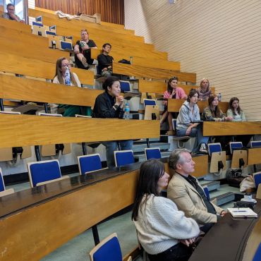 Event attendees in Theatre R during talk