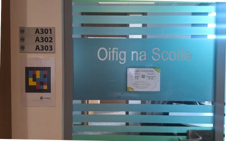 The NaviLens code hanging next to the office doors