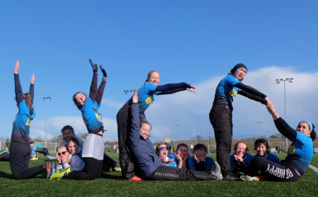 Ultimate Frisbee members making a UCD shape