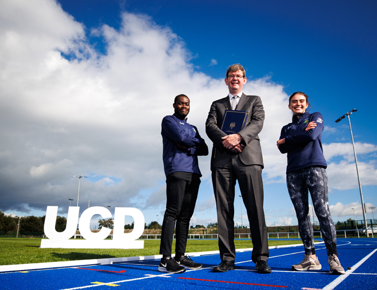 UCD Acting President Professor Mark Rogers pictured with UCD student athletes Bori Akinola and Lucy Barrett