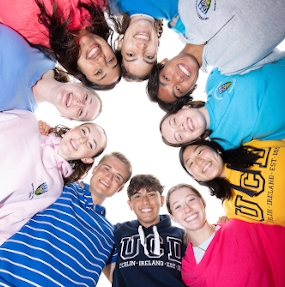 a diverse group of students in a circle above the camera