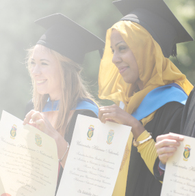 students graduating with degree scrolls