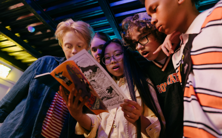 Young people reading a comic book