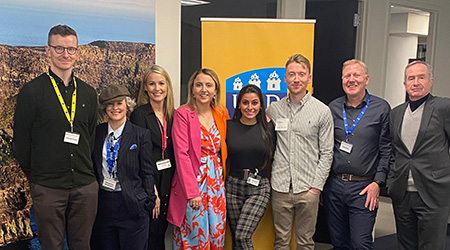 Group photo of presenters at an information session