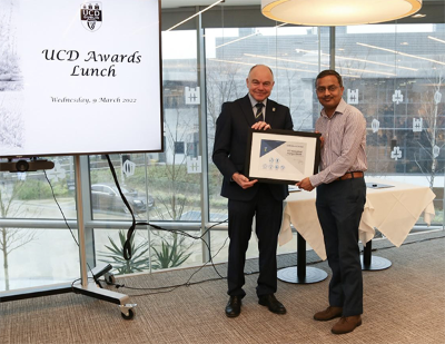 Arun Kumar receiving award from UCD President, Andrew Deeks