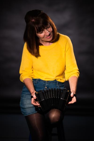 Brenda Castles playing the concertina