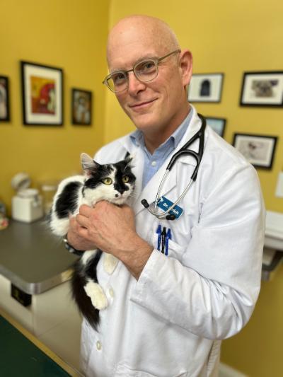 Christopher Ulrich holding a cat