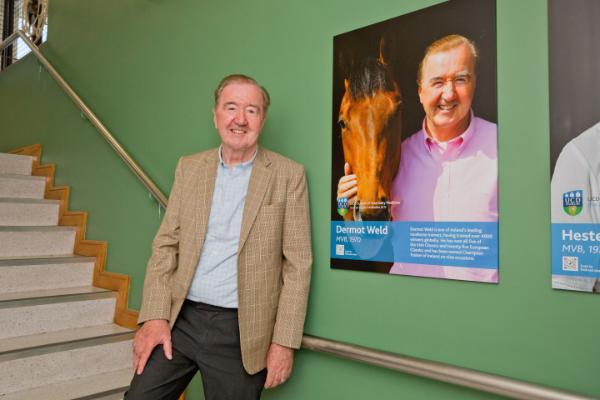 Dermot Weld with his image on the Alumni Wall