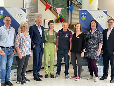 A group of staff and students standing in the foyer of the Vet School at the Pride event