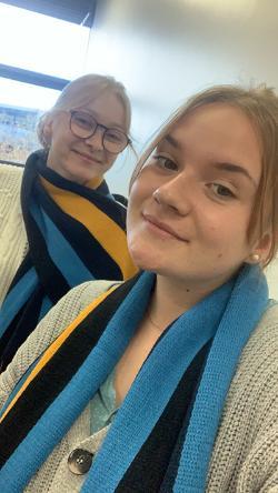 two vet school interns wearing a ucd scarf