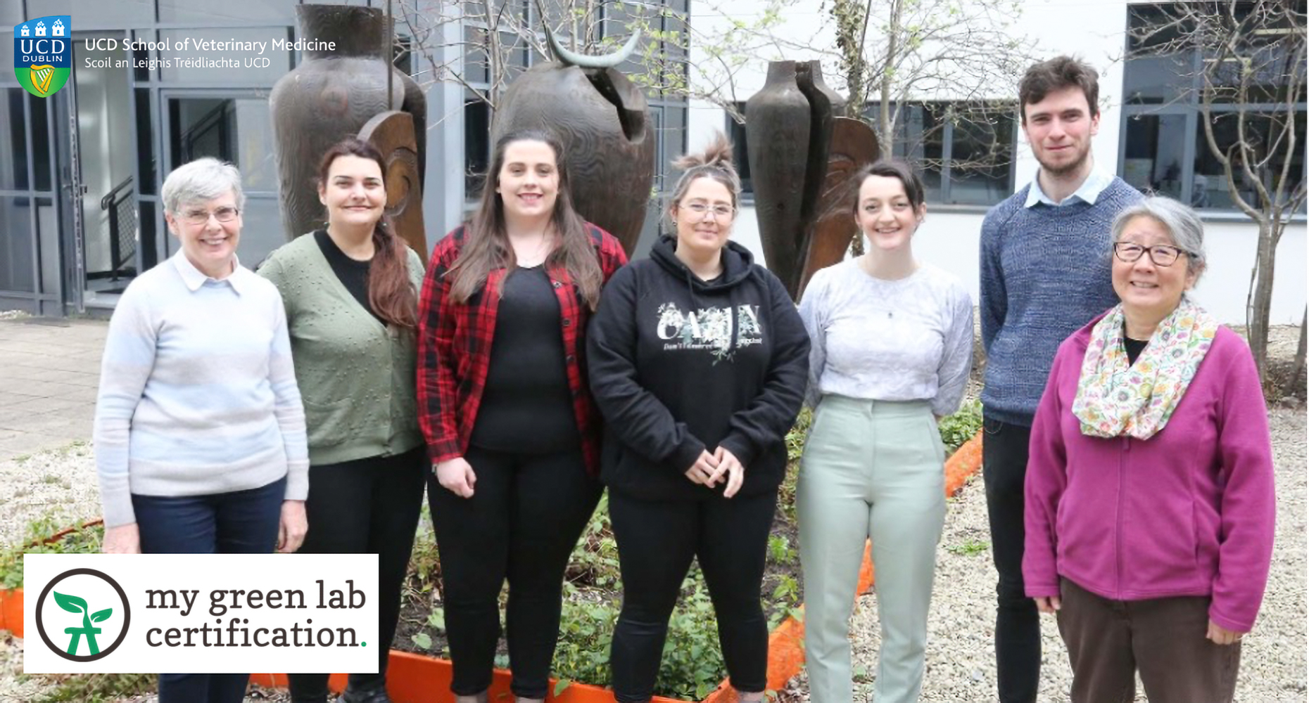 Seven members of the Vet School Microbiology and Parasitology Research group standing in the courtyard of the Vet School