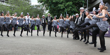 Image of faculty and staff participating in a dancing event at the UCD Festival